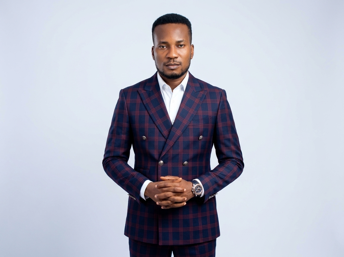 Amb. John Ifeanyi Amos in double-breasted formal suit