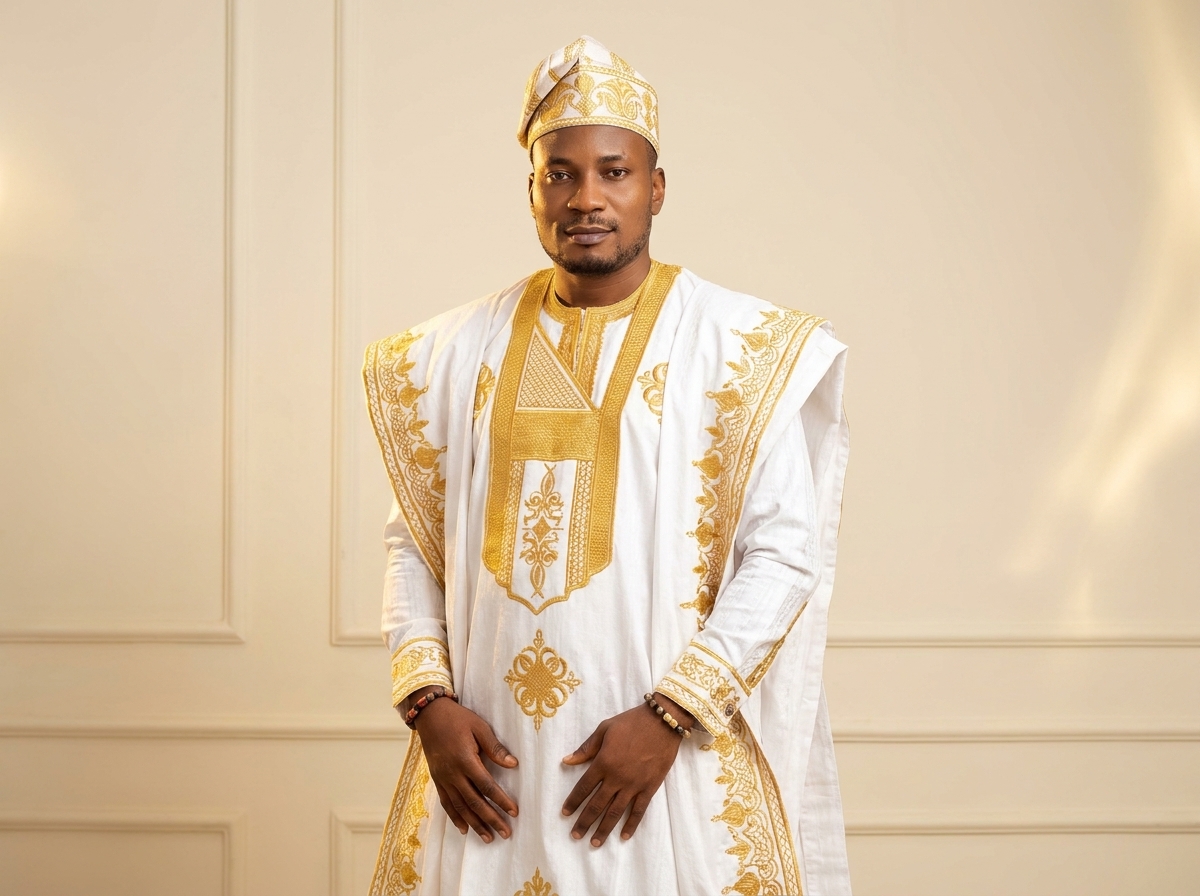 Amb. John Ifeanyi Amos in elegant white traditional attire